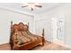 Bedroom with wood floors and a carved, four-poster bed at 1043 Linneys Mill Rd, Union Grove, NC 28689