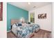 Bright bedroom with two twin beds, colorful accent wall, and carpet at 11225 Black Brant Ln, Charlotte, NC 28278