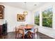 Cozy dining area features a round table with seating for six and bright natural light at 11225 Black Brant Ln, Charlotte, NC 28278