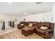 Upstairs living room with recliner seating, plush carpet, and natural light at 11225 Black Brant Ln, Charlotte, NC 28278