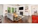 Comfortable living room with a fireplace, built-in shelving, and natural light streaming through the windows at 11225 Black Brant Ln, Charlotte, NC 28278