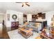 Open-concept living room features hardwood floors and stylish furnishings, flowing seamlessly into the adjacent kitchen at 11225 Black Brant Ln, Charlotte, NC 28278