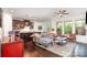 Inviting open-concept living space featuring hardwood floors and seamlessly connecting the living room and kitchen areas at 11225 Black Brant Ln, Charlotte, NC 28278
