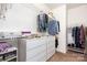 Spacious walk-in closet with drawers, shelves, and racks for organized storage at 11225 Black Brant Ln, Charlotte, NC 28278