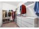 Walk-in closet featuring shoe racks, drawers and shelves for optimal organization at 11225 Black Brant Ln, Charlotte, NC 28278