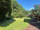 Picturesque backyard featuring lush greenery and mature trees, creating a serene outdoor space at 1335 33Rd Avenue Ne Dr, Hickory, NC 28601