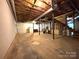 Unfinished basement with concrete floor, exposed ceiling, and staircase at 1335 33Rd Avenue Ne Dr, Hickory, NC 28601