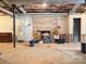 Unfinished basement with brick fireplace and ample storage space at 1335 33Rd Avenue Ne Dr, Hickory, NC 28601