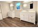 Modern bathroom featuring double vanity, hardwood floors and updated fixtures at 1335 33Rd Avenue Ne Dr, Hickory, NC 28601