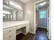 Bathroom vanity with a large mirror and access to a bathtub/shower room at 1335 33Rd Avenue Ne Dr, Hickory, NC 28601