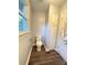 Bathroom featuring a toilet, a linen closet, and a window at 1335 33Rd Avenue Ne Dr, Hickory, NC 28601