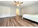 Bedroom featuring wood flooring, a ceiling fan, and a door to an ensuite bathroom at 1335 33Rd Avenue Ne Dr, Hickory, NC 28601
