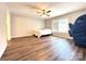 Spacious bedroom with hardwood floors, ceiling fan, and natural light from a window at 1335 33Rd Avenue Ne Dr, Hickory, NC 28601