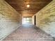 Covered breezeway with brick walls, wood ceiling, and a brick floor at 1335 33Rd Avenue Ne Dr, Hickory, NC 28601