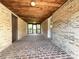 Covered breezeway with brick walls, a wooden ceiling, and access doors at 1335 33Rd Avenue Ne Dr, Hickory, NC 28601