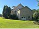 Side view of a brick home with an attached garage and gable roof at 1335 33Rd Avenue Ne Dr, Hickory, NC 28601