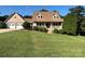 Charming brick home featuring a manicured lawn, two car garage, and a cozy front porch at 1335 33Rd Avenue Ne Dr, Hickory, NC 28601