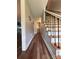 Hallway featuring hardwood floors, modern light fixtures, and stairs at 1335 33Rd Avenue Ne Dr, Hickory, NC 28601