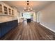A wide-open kitchen with a central island, modern appliances, and hardwood floors at 1335 33Rd Avenue Ne Dr, Hickory, NC 28601