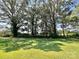 Large lot with mature trees and plush green grass at 147 Dutchman Rd, Harmony, NC 28634