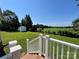 Backyard with lush green grass, mature trees, and a storage shed at 147 Dutchman Rd, Harmony, NC 28634