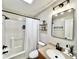 Updated bathroom featuring a shower and tub, with updated hardware and fixtures at 147 Dutchman Rd, Harmony, NC 28634