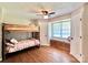Charming bedroom features a bunk bed, wood floors, and a window seat at 147 Dutchman Rd, Harmony, NC 28634