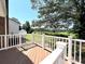 Deck showing railing overlooking a beautiful yard with lush green grass and trees at 147 Dutchman Rd, Harmony, NC 28634