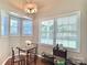 Bright dining nook features a bay window, modern lighting and a cozy table setting at 147 Dutchman Rd, Harmony, NC 28634