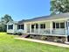 Charming one-story home featuring a welcoming front porch and meticulously landscaped walkway at 147 Dutchman Rd, Harmony, NC 28634