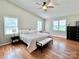 Spacious main bedroom with hardwood floors, vaulted ceiling, and ample natural light at 147 Dutchman Rd, Harmony, NC 28634