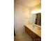 Modest bathroom featuring a light countertop with a single sink and wood cabinets at 1541 Kings Rd, Shelby, NC 28150