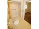 Compact bathroom featuring a shower with sliding doors, a toilet, and a glimpse of the adjacent bedroom at 1541 Kings Rd, Shelby, NC 28150