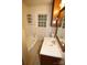 Small bathroom featuring a tub, toilet, and single sink with a wood cabinet at 1541 Kings Rd, Shelby, NC 28150