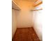 Small walk-in closet featuring wood floors and a simple shelf with hanging rod at 1541 Kings Rd, Shelby, NC 28150