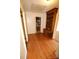 Hallway featuring a built-in bookcase and a doorway leading to a bathroom at 1541 Kings Rd, Shelby, NC 28150