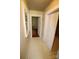 A hallway featuring neutral walls, a window, a closet, and an entryway with hardwood floors at 1541 Kings Rd, Shelby, NC 28150
