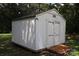 Exterior shot of a white wooden outbuilding with a small wooden ramp entrance at 1541 Kings Rd, Shelby, NC 28150