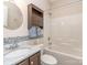 Bathroom featuring stylish vanity, marble countertop, and tile backsplash, plus tub with shower at 15739 Circlegreen Dr, Charlotte, NC 28273