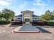 Community clubhouse entrance with well-manicured landscaping and convenient parking at 15739 Circlegreen Dr, Charlotte, NC 28273