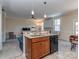 Open kitchen with granite countertops and stainless steel appliances, perfect for modern living at 15739 Circlegreen Dr, Charlotte, NC 28273