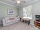 Inviting living room with a neutral sofa and soft lighting, creating a cozy and relaxing atmosphere at 15739 Circlegreen Dr, Charlotte, NC 28273