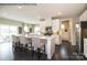 Bright kitchen featuring an island with counter seating, stainless steel appliances, and sliding door access to outdoor space at 2020 Bramble Hedge Rd # 3276, Indian Trail, NC 28079