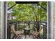 Relaxing balcony featuring a cozy seating area with views of the surrounding greenery at 207 N Dotger Ave # C14, Charlotte, NC 28207