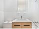 This bathroom has a toilet, vanity, mirror, and tub with a shower at 207 N Dotger Ave # C14, Charlotte, NC 28207