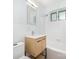 This bathroom has a toilet, vanity, mirror, and tub with a shower at 207 N Dotger Ave # C14, Charlotte, NC 28207