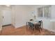 Inviting dining area features a table and chairs near a window, providing natural light at 207 N Dotger Ave # C14, Charlotte, NC 28207
