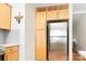 This kitchen features wooden cabinets and a stainless steel refrigerator at 207 N Dotger Ave # C14, Charlotte, NC 28207