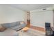Relaxing living room with natural light, a comfortable seating area, and hardwood floors at 207 N Dotger Ave # C14, Charlotte, NC 28207