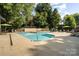 Beautiful community pool featuring ample seating, lounge chairs, and well-maintained landscaping at 207 N Dotger Ave # C14, Charlotte, NC 28207